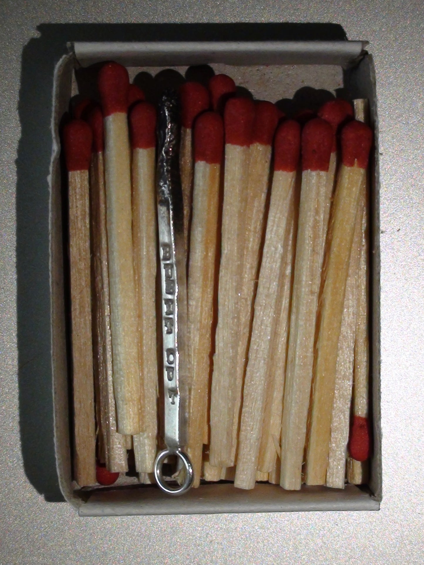 Burnt match mono earring