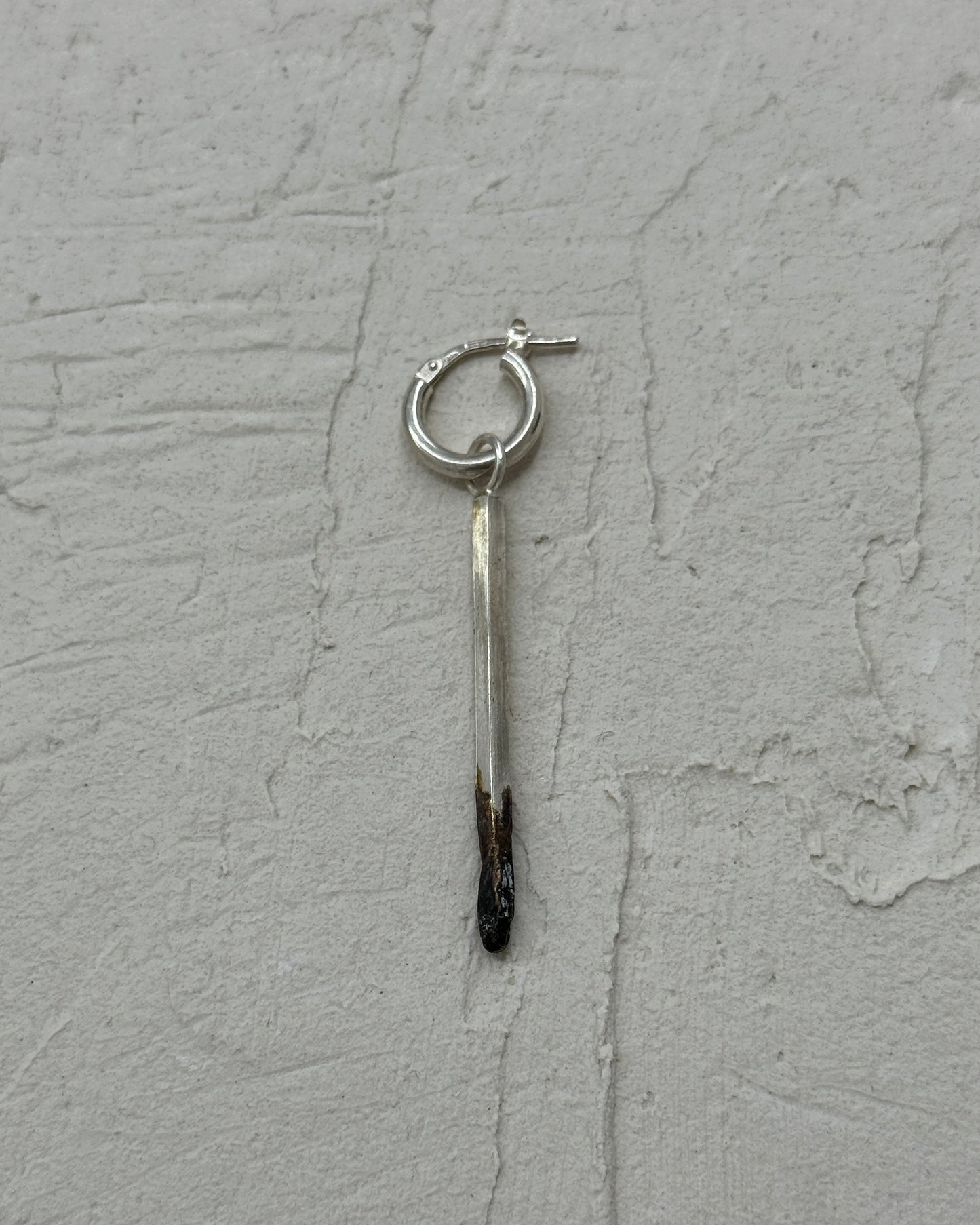 Burnt match mono earring